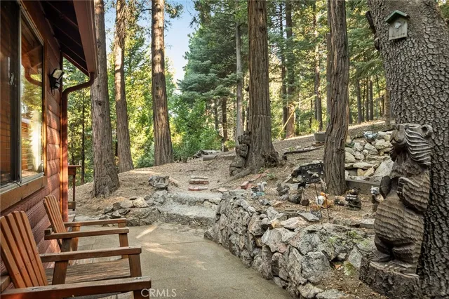 a view of a backyard with sitting area