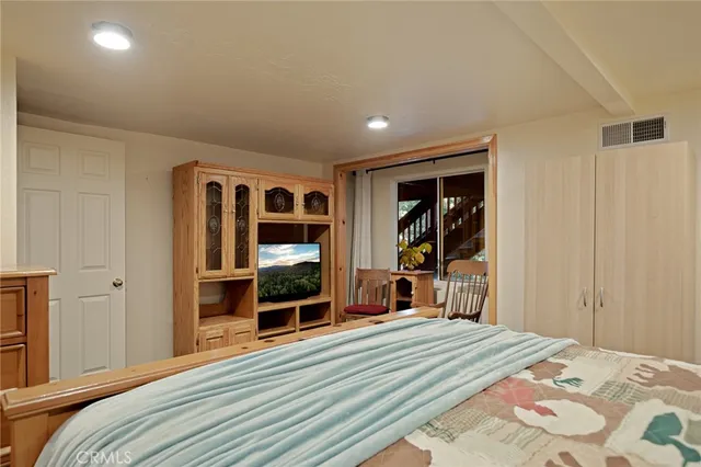 a bedroom with a bed and closet