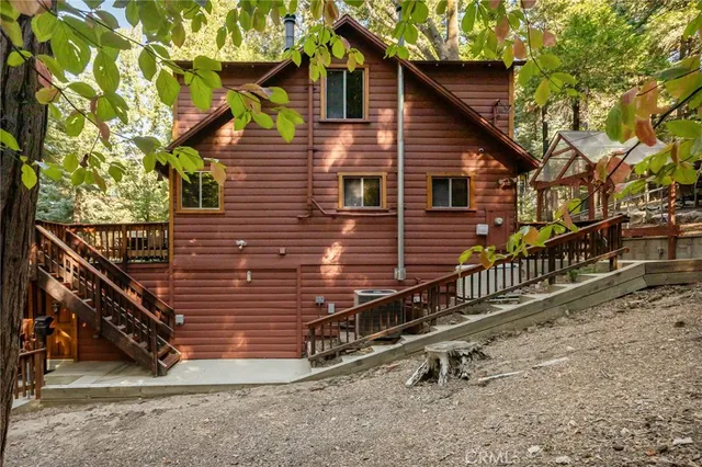 a view of a house with wooden fence