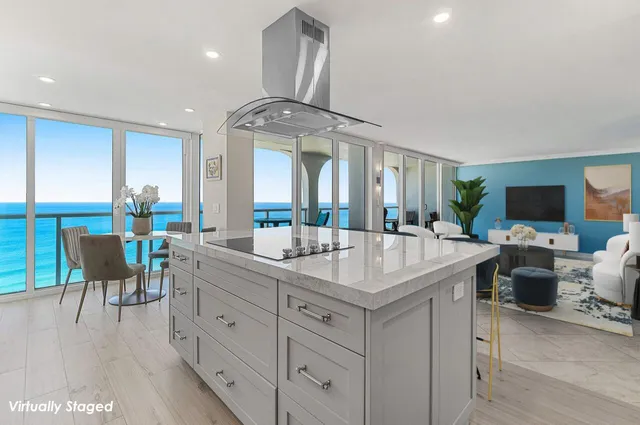 a view of living room kitchen island dining table and chairs