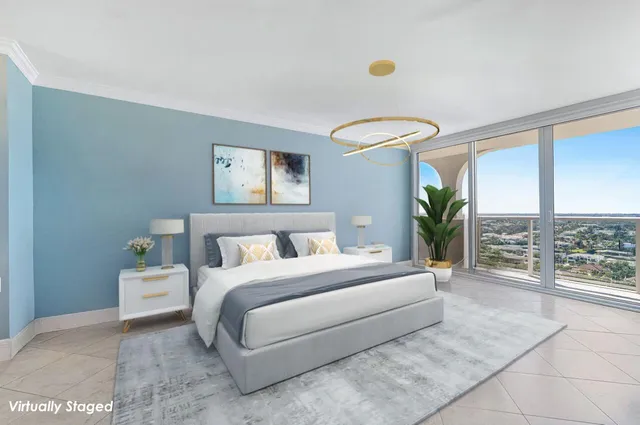 a bedroom with a large bed and a large window