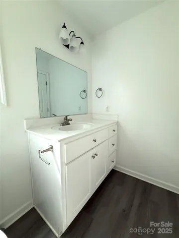 a utility room with cabinets washer and dryer