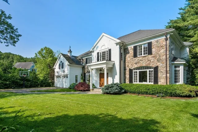 a front view of house with yard and green space