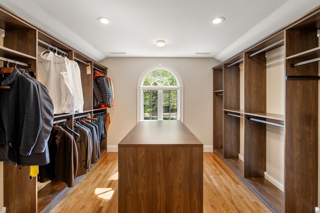 69 Princeton Road Brookline, MA 02467 - Photo 20 of 28 a view of walk in closet with clothes and shoes