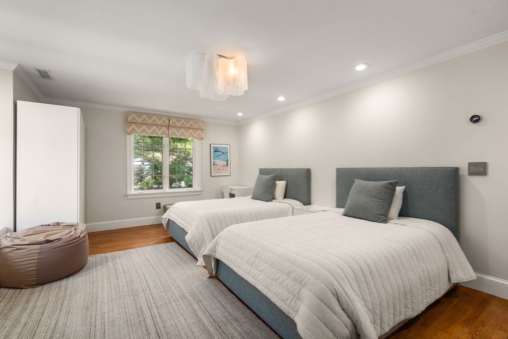 69 Princeton Road Brookline, MA 02467 - Photo 23 of 28 a bedroom with two beds and a potted plant