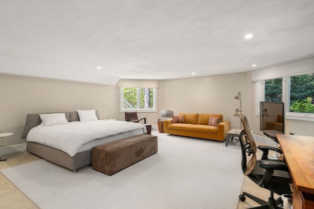 69 Princeton Road Brookline, MA 02467 - Photo 25 of 28 a living room with a bed furniture and a window