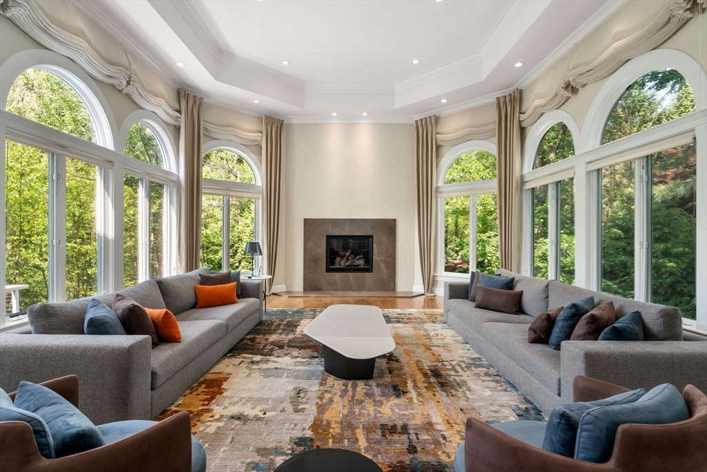69 Princeton Road Brookline, MA 02467 - Photo 4 of 28 a living room with furniture and a large window