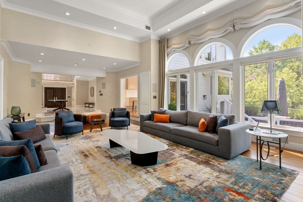 69 Princeton Road Brookline, MA 02467 - Photo 5 of 28 a living room with furniture and a large window
