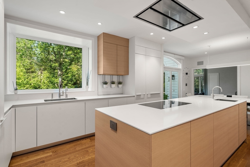 69 Princeton Road Brookline, MA 02467 - Photo 8 of 28 a kitchen with a stove a sink and a refrigerator