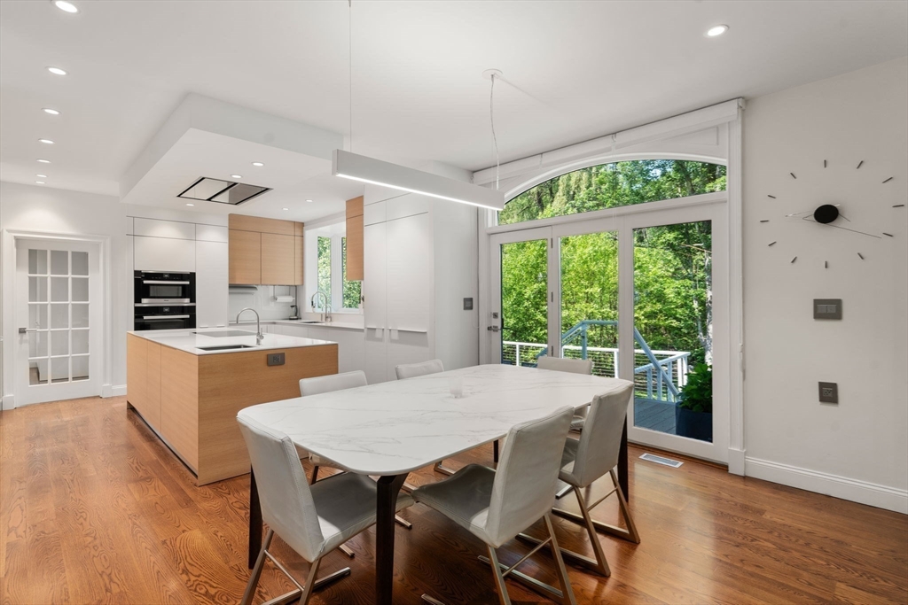 69 Princeton Road Brookline, MA 02467 - Photo 9 of 28 a view of a dining room with furniture window and wooden floor