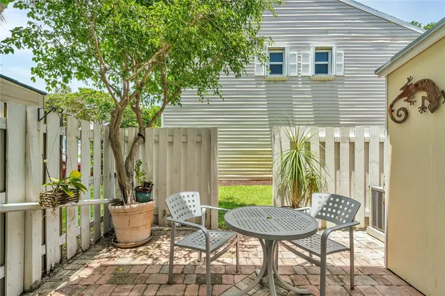 an aerial view of multiple houses with yard