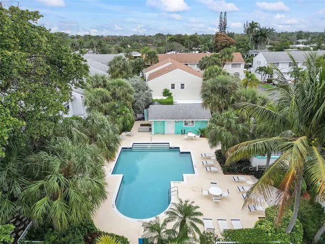 a view of a table and chairs in back of the house