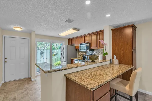 a potted plant sitting in front of a door