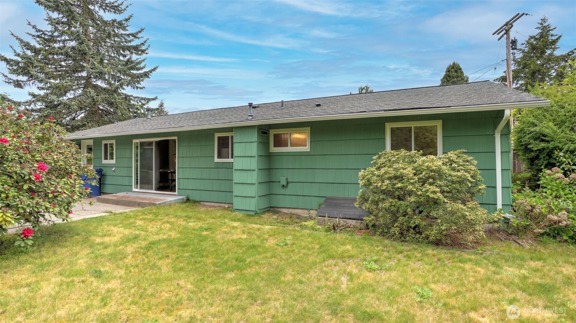 12515 Southeast 171st Street Renton, WA 98058 - Photo 23 of 24 a view of a house with a garden