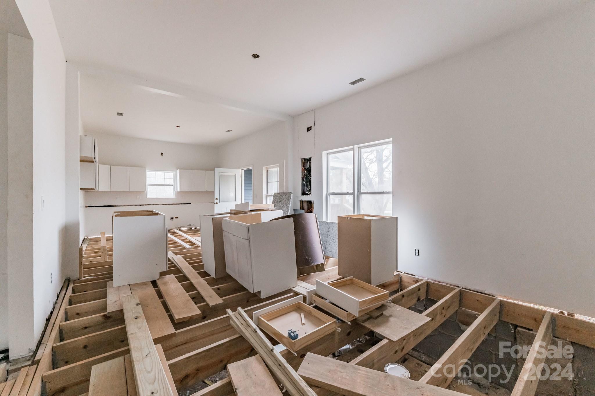 1119 Poplar Street Albemarle, NC 28001 - Photo 9 of 11 a living room with a couch and a window with wooden floor
