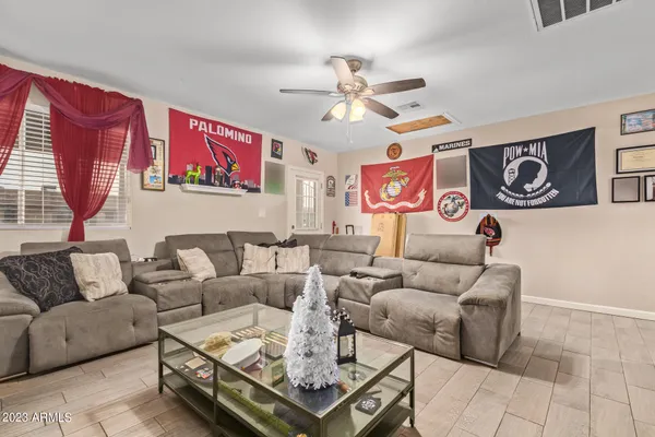 a living room with furniture and a window