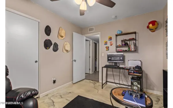 a room with furniture and musical instruments