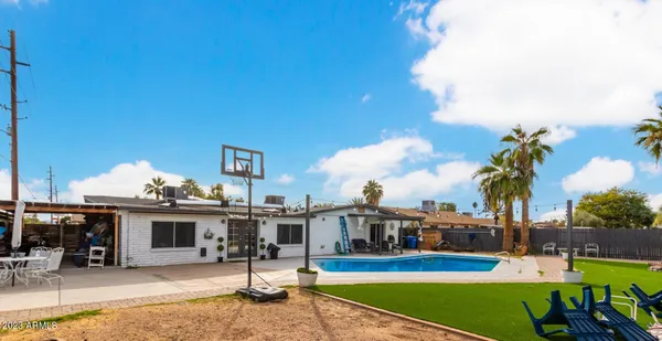 a view of a swimming pool with a patio
