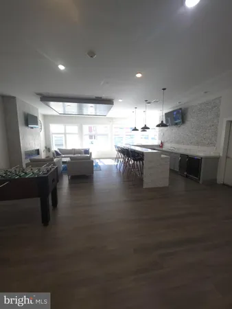 a kitchen with lots of counter top space and dining table