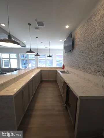 a kitchen with a sink and counter top space