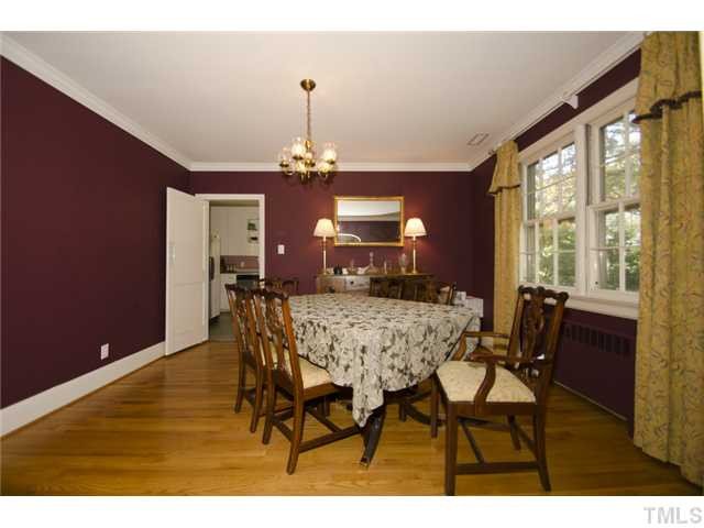 1324 Canterbury Road Raleigh, NC 27608 - Photo 5 of 16 Arched doorway leads you into the formal dining room with hardwood floors and crown molding. Dining Room