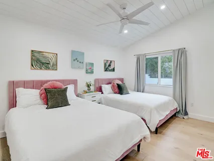 a bedroom with bed and a window