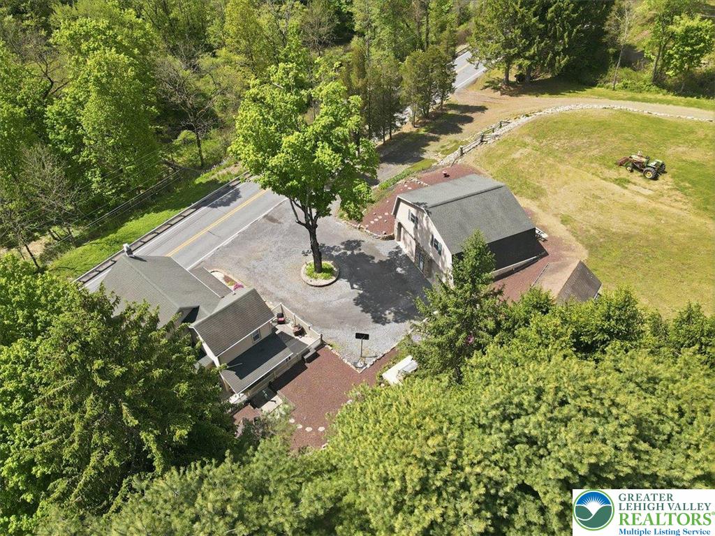 4880 Little Gap Road Kunkletown, PA 18058 - Photo 90 of 100 This expansive aerial view showcases a residential property nestled amongst lush greenery and open spaces.