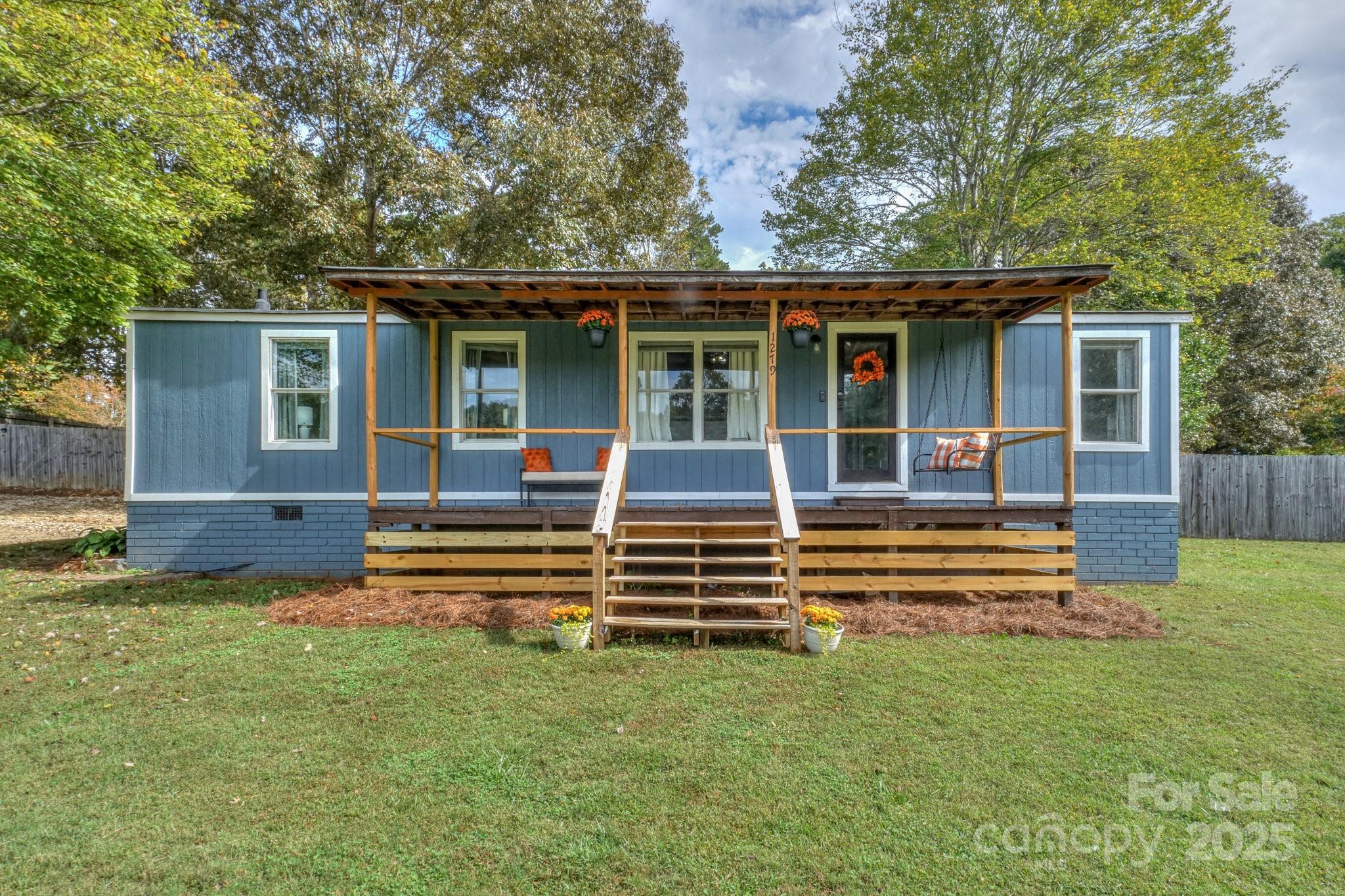 1279 Craig Drive Iron Station, NC 28080 - Photo 1 of 47 front view of a house with a yard