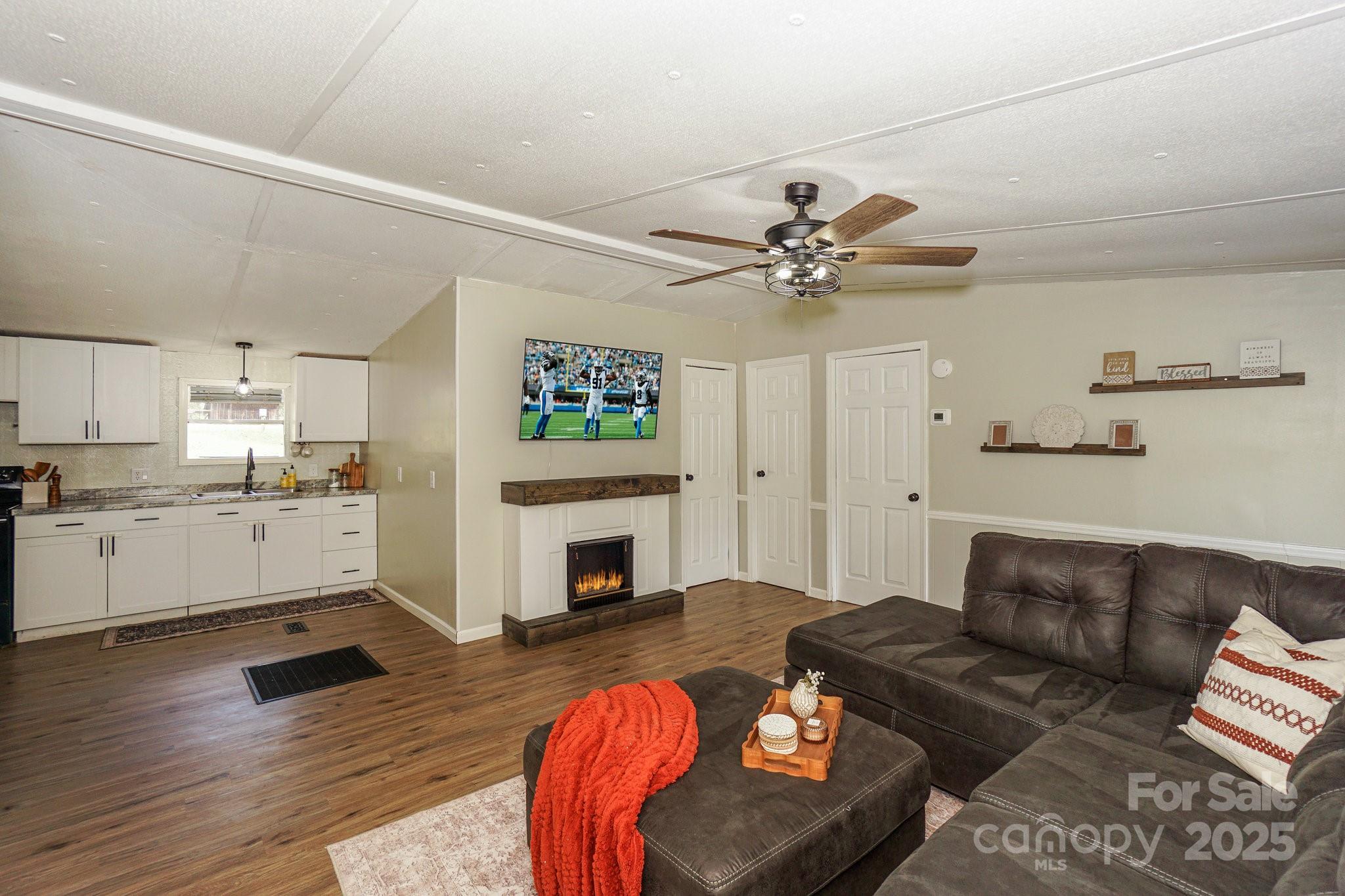 1279 Craig Drive Iron Station, NC 28080 - Photo 13 of 47 a living room with furniture fireplace and a table