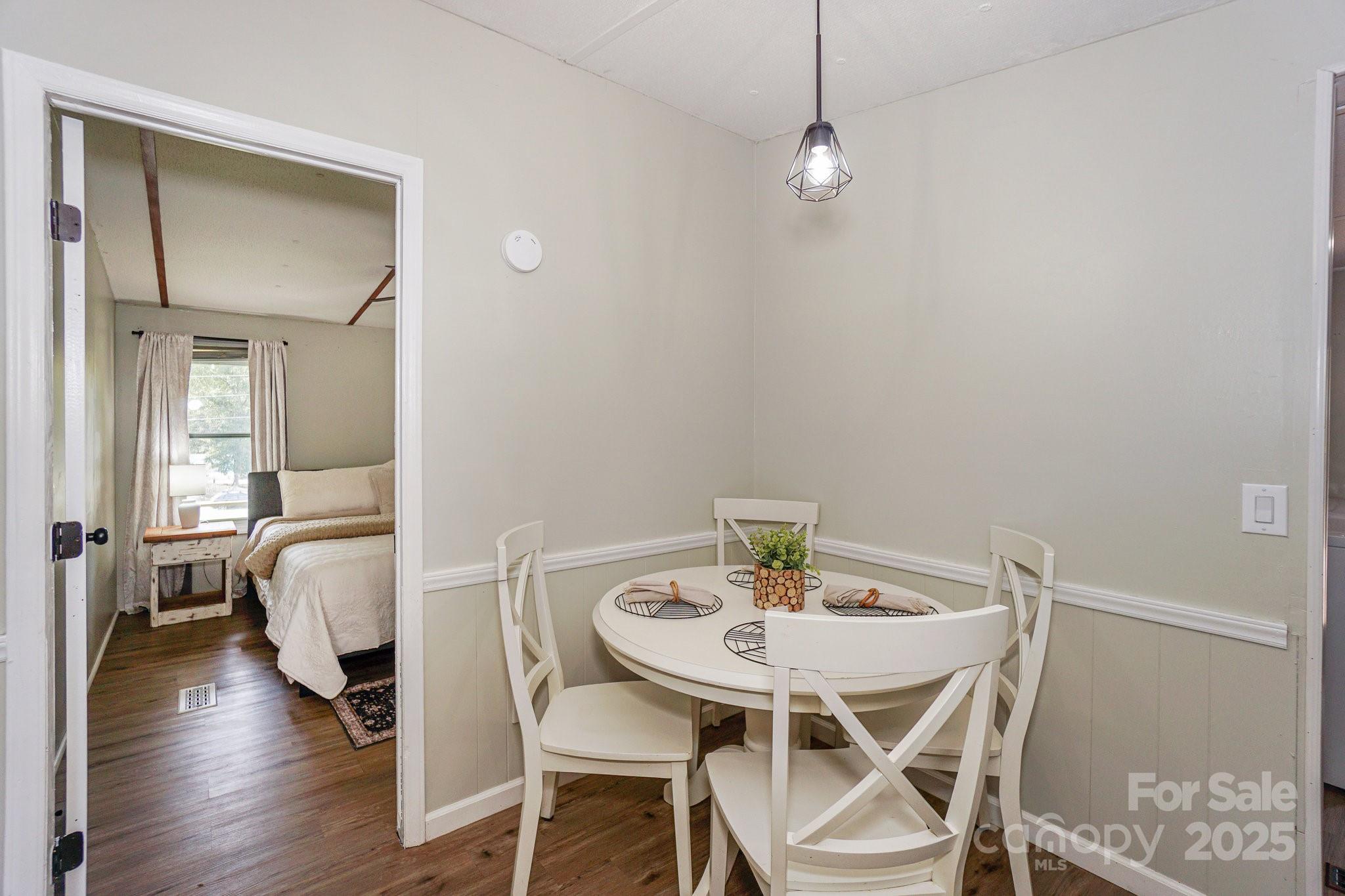 1279 Craig Drive Iron Station, NC 28080 - Photo 20 of 47 a view of a dining room with furniture and wooden floor