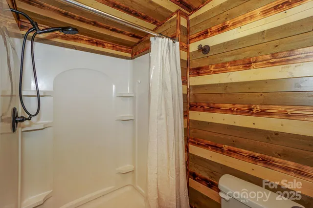 a bedroom with a bed and cabinets