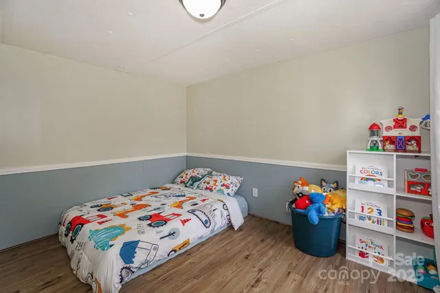 a view of room with wooden floor