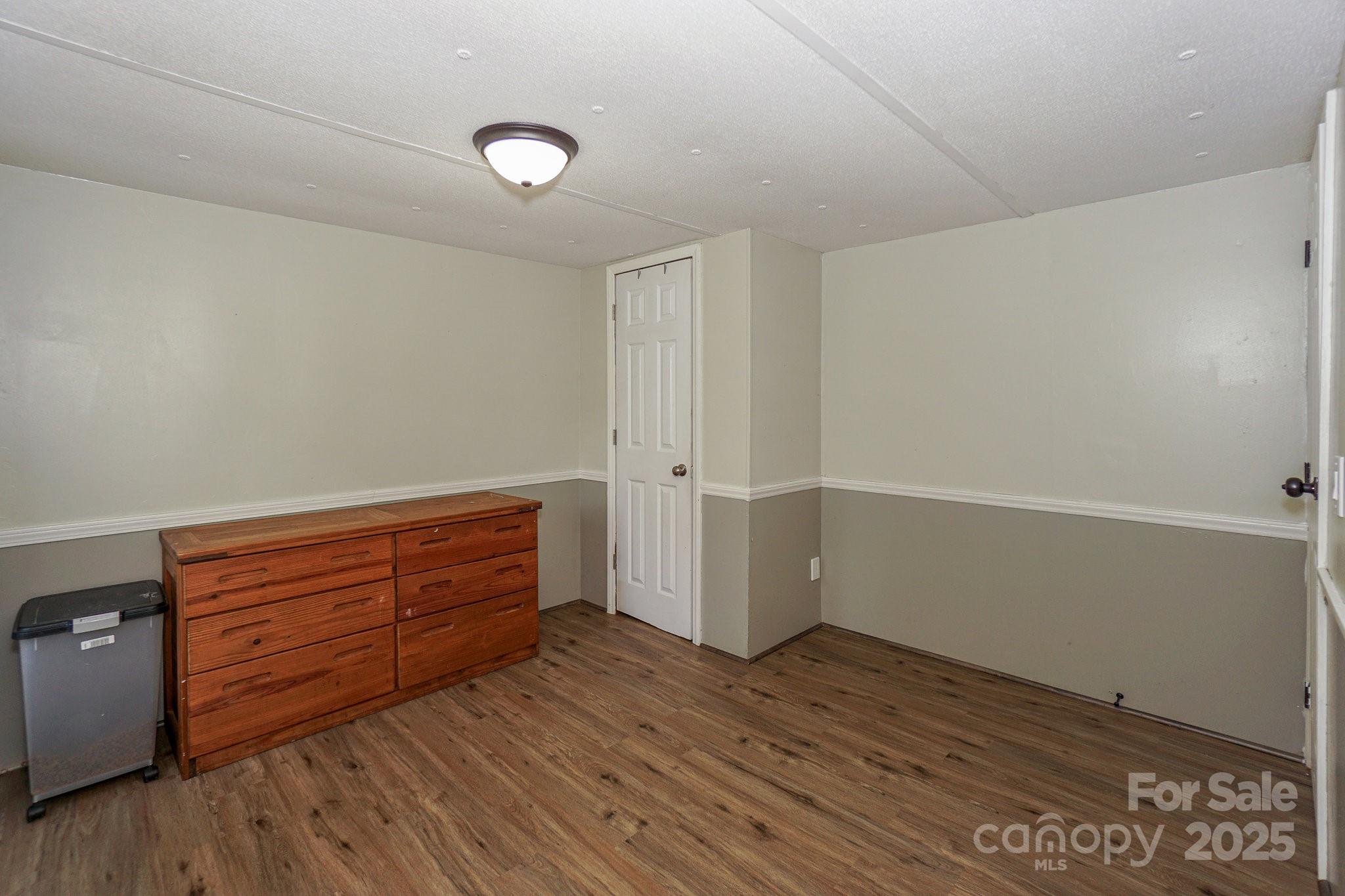 1279 Craig Drive Iron Station, NC 28080 - Photo 30 of 47 a view of room with wooden floor