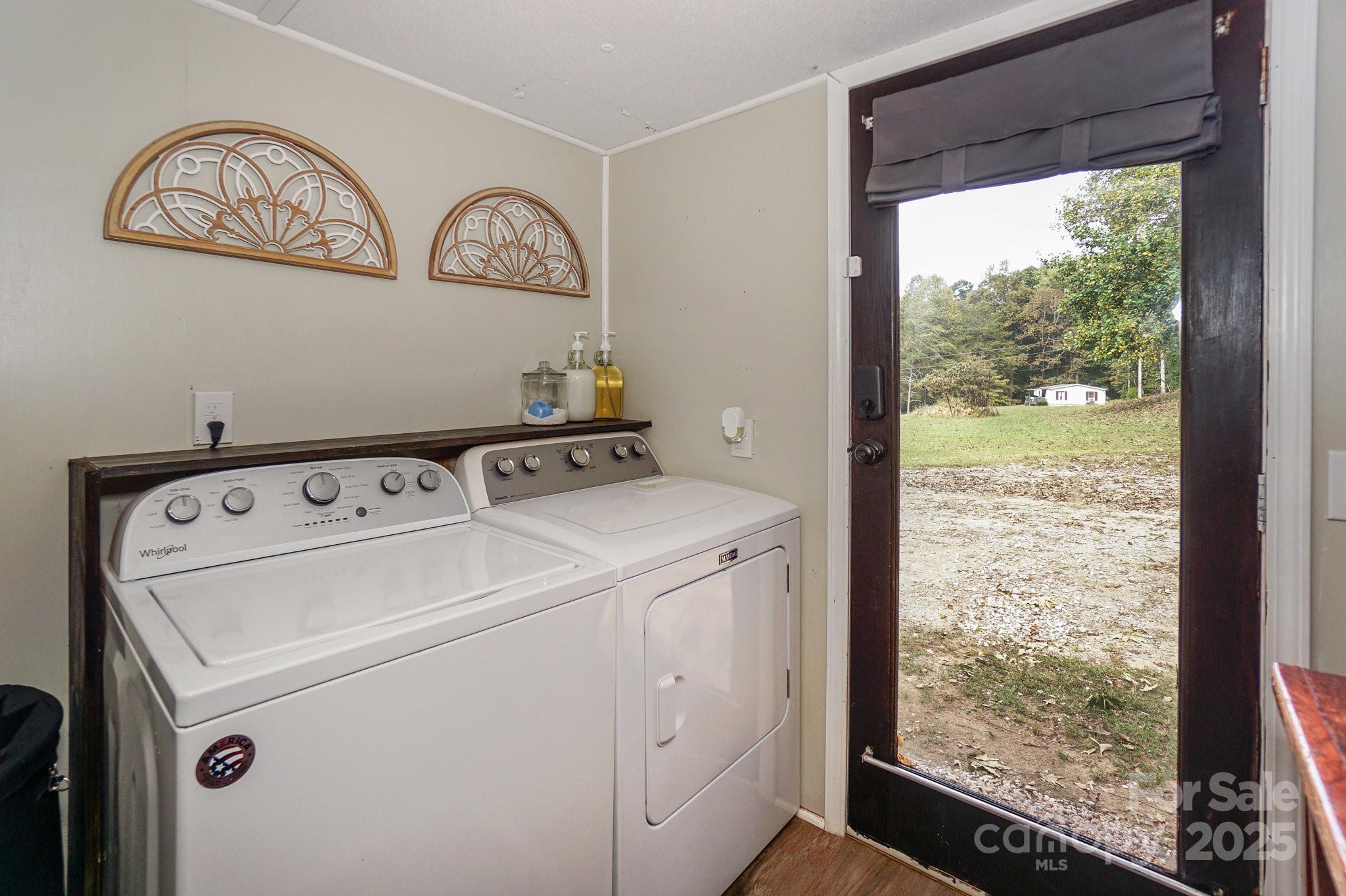 1279 Craig Drive Iron Station, NC 28080 - Photo 38 of 47 a view of washer and dryer with bathroom in the background