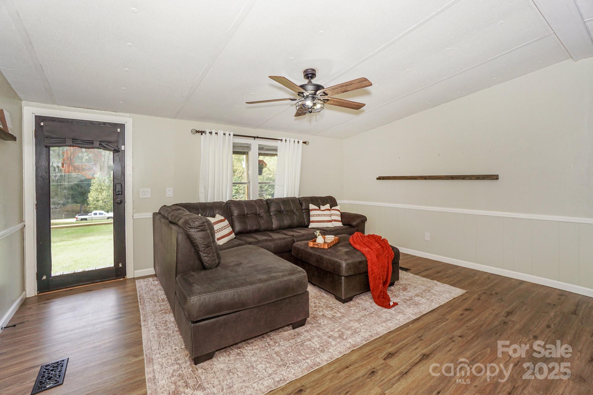 1279 Craig Drive Iron Station, NC 28080 - Photo 10 of 47 a living room with furniture and wooden floor