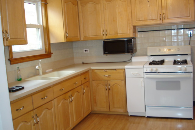 2427 Keystone Avenue North Riverside, IL 60546 - Photo 4 of 14 a kitchen with granite countertop white cabinets and white appliances