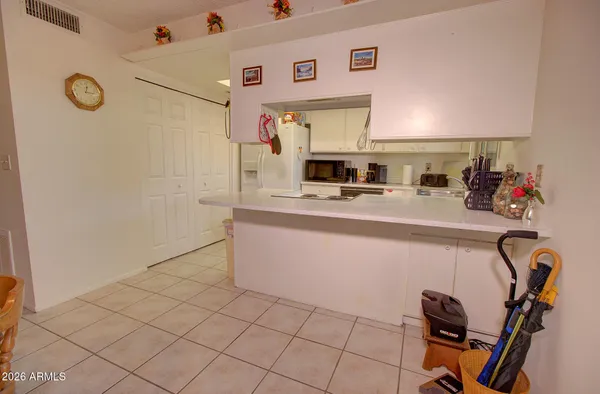 a kitchen with a sink cabinets and appliances