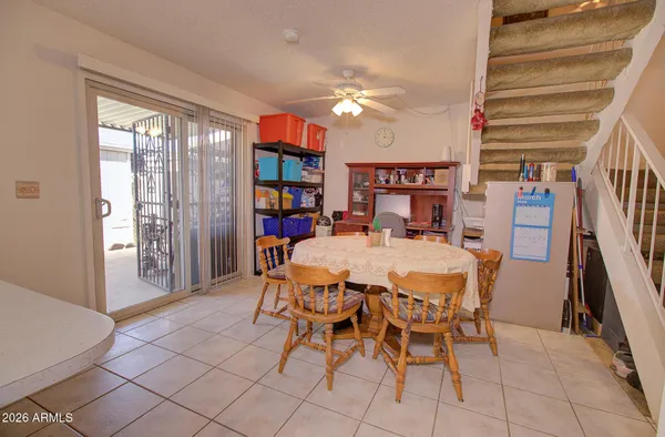 a dining room with furniture and window