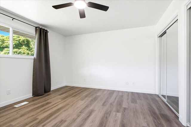 1676 East 11245 South Sandy, UT 84092 - Photo 18 of 34 Room with wood-finish flooring, white walls, and white trim
