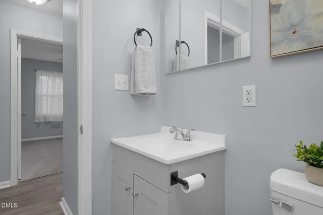 a bathroom with a sink and mirror
