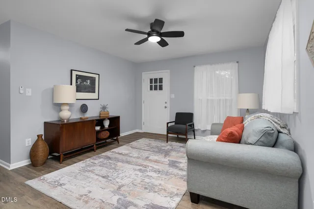 a living room with furniture and a rug