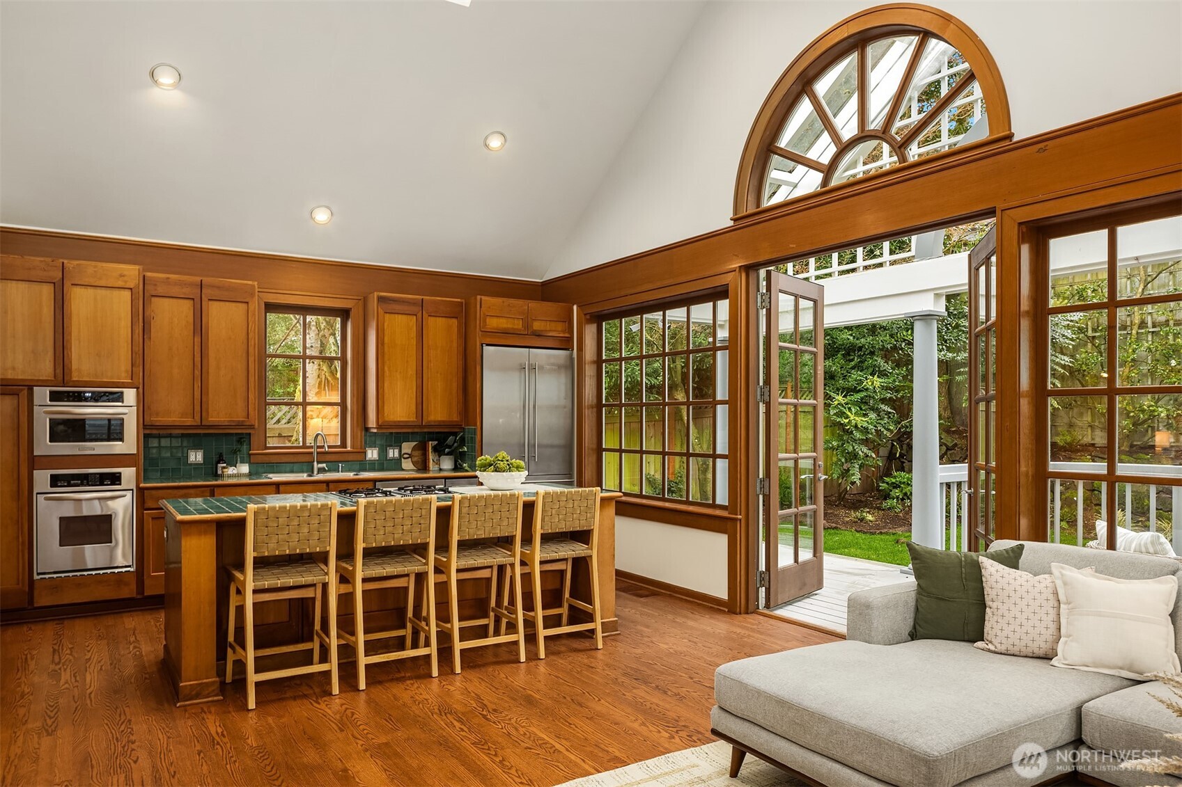 7016 28th Avenue Northeast Seattle, WA 98115 - Photo 12 of 32 a very nice looking living room with a large window and a kitchen view