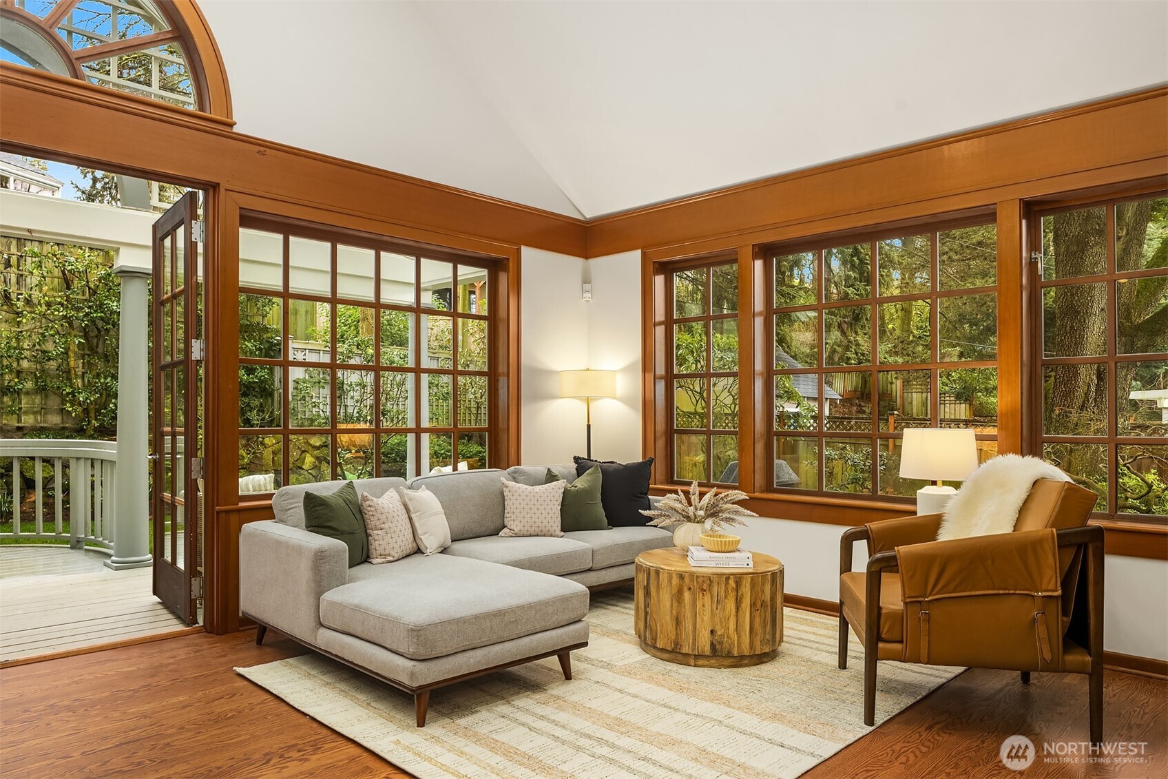 7016 28th Avenue Northeast Seattle, WA 98115 - Photo 14 of 32 a living room with furniture and floor to ceiling windows