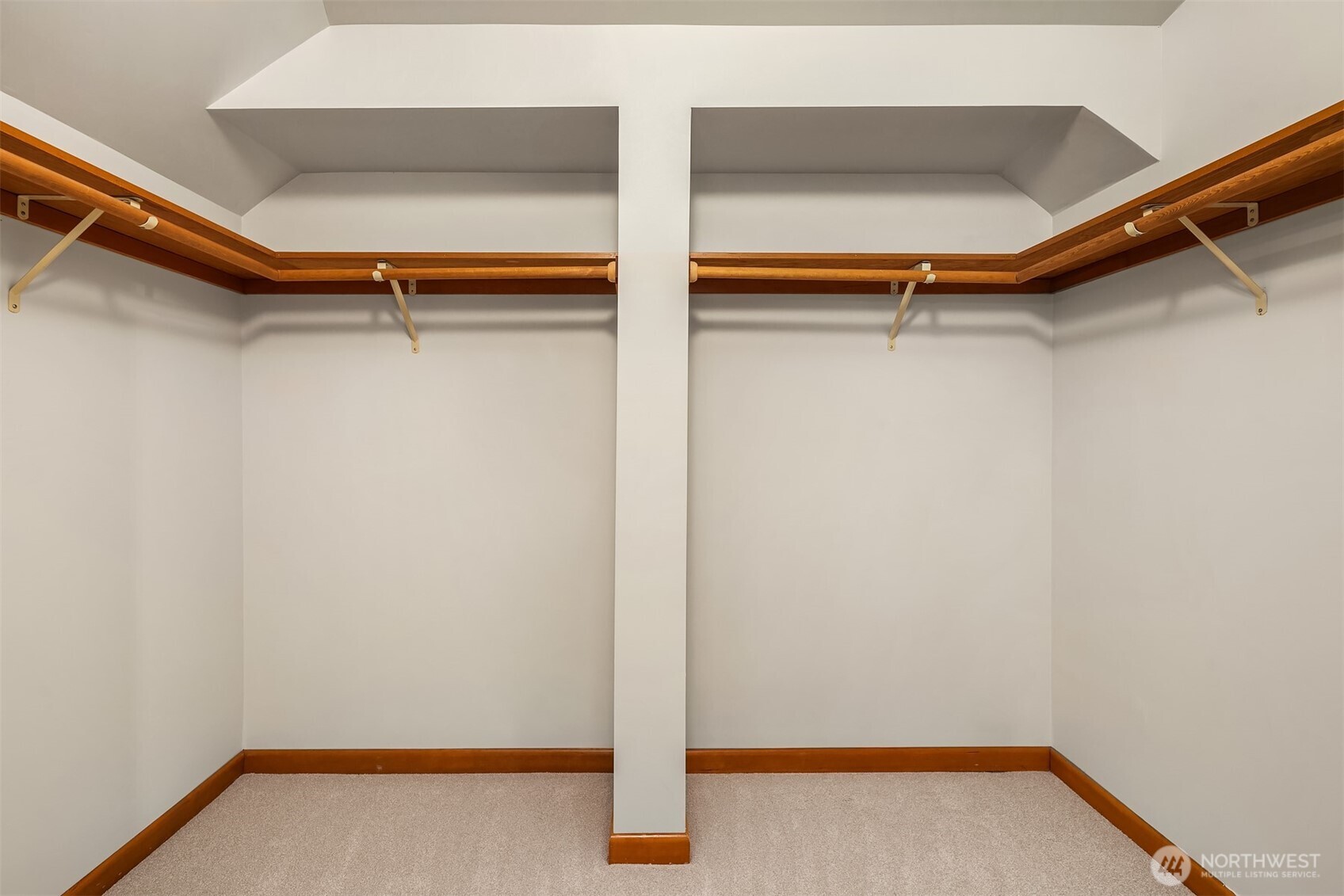 7016 28th Avenue Northeast Seattle, WA 98115 - Photo 18 of 32 a view of walk in closet with empty racks