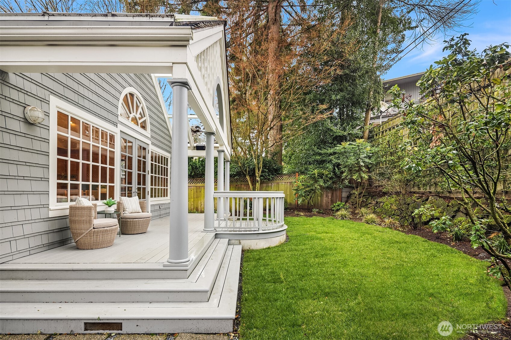 7016 28th Avenue Northeast Seattle, WA 98115 - Photo 31 of 32 a view of a white house with a big yard and potted plants