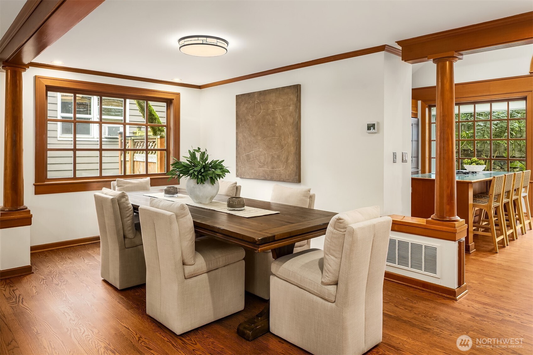 7016 28th Avenue Northeast Seattle, WA 98115 - Photo 6 of 32 a view of a dining room with furniture window and wooden floor