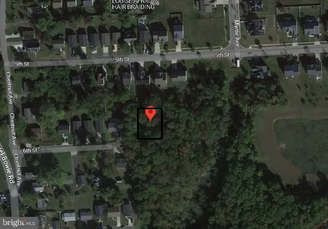 an aerial view of house with swimming pool a yard and outdoor seating
