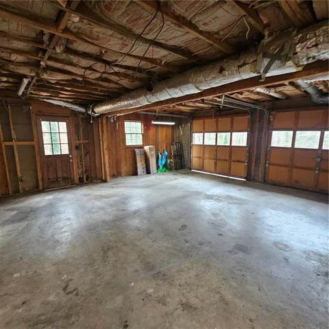 a view of an empty room with windows