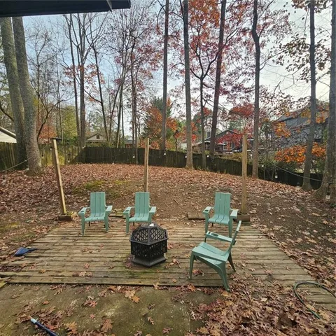 a view of a backyard with sitting area