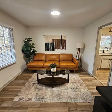 a living room with furniture and a rug
